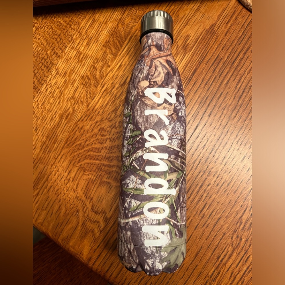 Mossy Oak water bottle with “Brandon” sticker on it